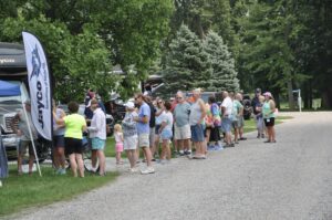 Campgoers lining up to see a vendor